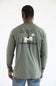 A man from the back wearing the Carhartt Irvine Relaxed Pointer Dog Long Sleeve T-Shirt for Men in Dusty Olive Green featuring a Carhartt logo down the left arm and pointer dog logo with birds on the back.