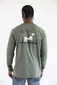 A man from the back wearing the Carhartt Irvine Relaxed Pointer Dog Long Sleeve T-Shirt for Men in Dusty Olive Green featuring a Carhartt logo down the left arm and pointer dog logo with birds on the back.