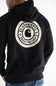 Detailed: Back view of a man wearing a black Carhartt Sawyer hoodie featuring a circular camo back graphic with the Carhartt logo and "1889 Built To Last" text.