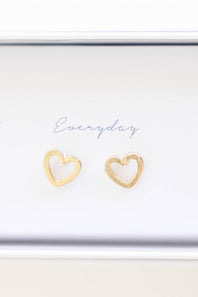 A pair of small open heart stud earrings in a gold-tone finish, displayed on a white card that reads 'Everyday'.
