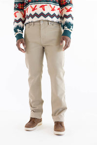 A person wearing beige chino-style trousers, a multicolor patterned sweater, and brown shoes, shown from the chest down against a plain white studio background.