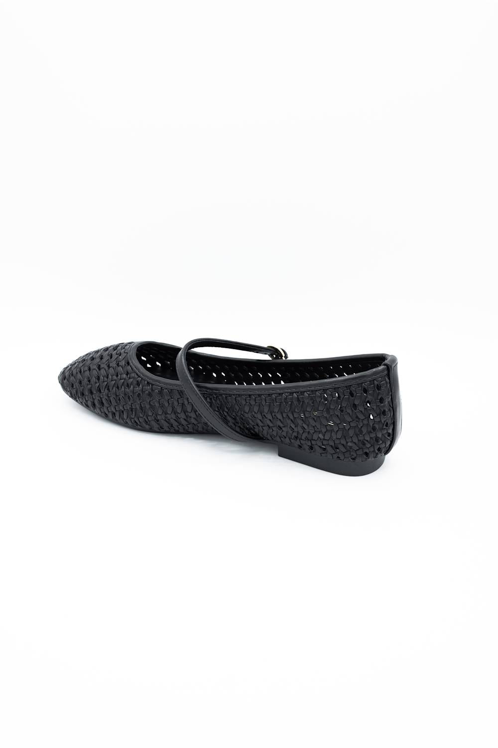 Image of a singular woven flat with a  strap across the ankle 