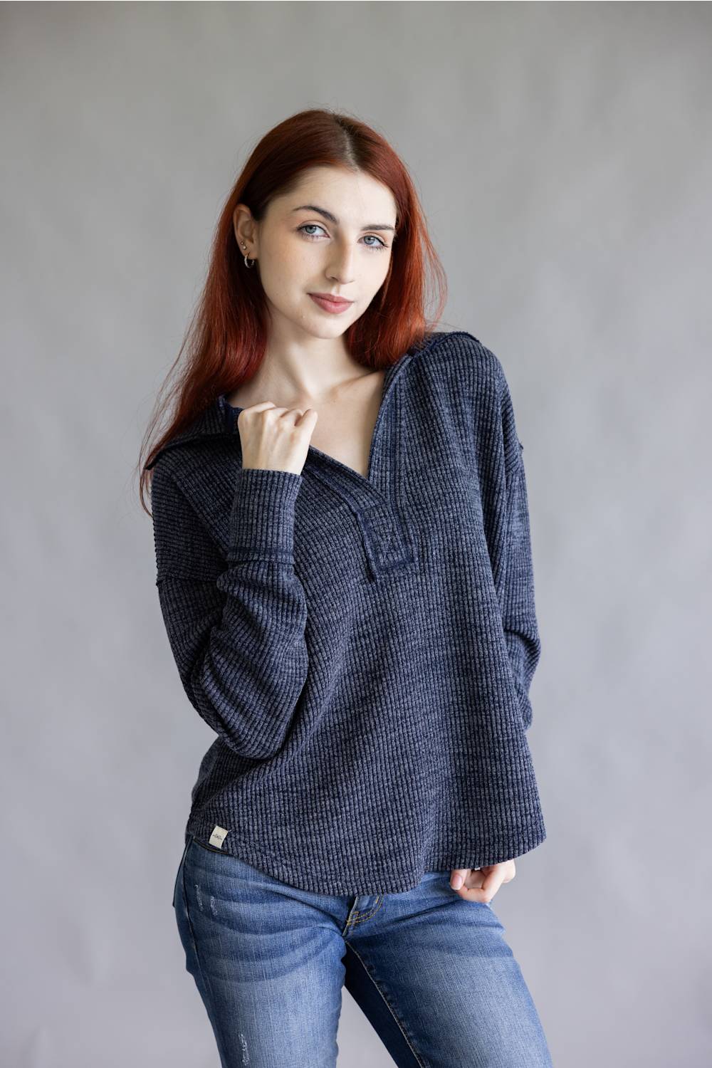 Ribbed v-neck sweater top with long sleeves and exposed seams