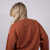 1897 Active Embroidered Pumpkin Face Sweatshirt for Women in Rust