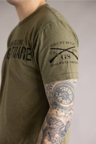 Grunt Style 1776 HR Nightmare T-Shirt for Men in Green; Person wearing a green t-shirt with military-themed text and graphics, standing against a neutral background.