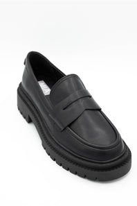 Black dress shoes with textured details on a white background