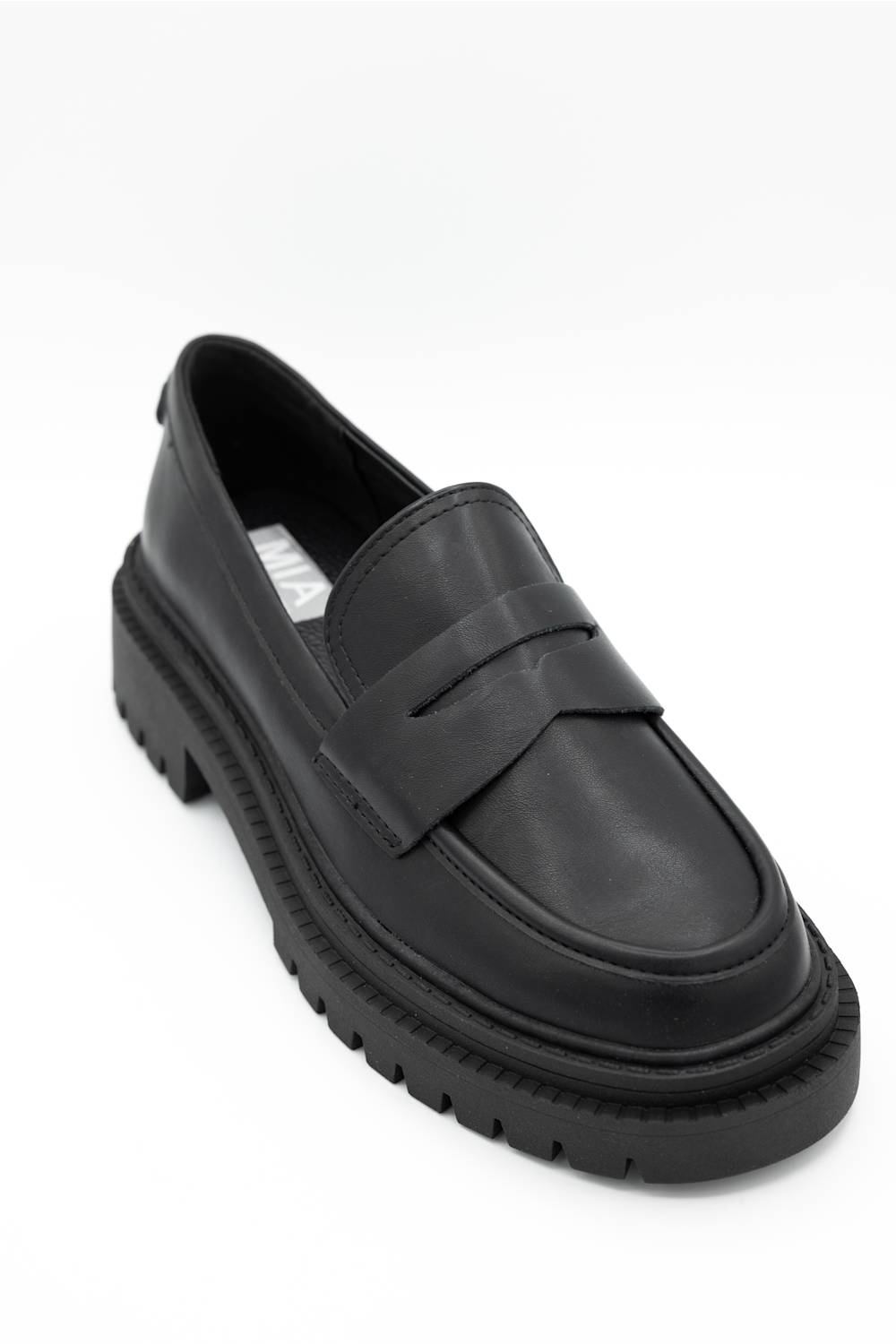 Black dress shoes with textured details on a white background