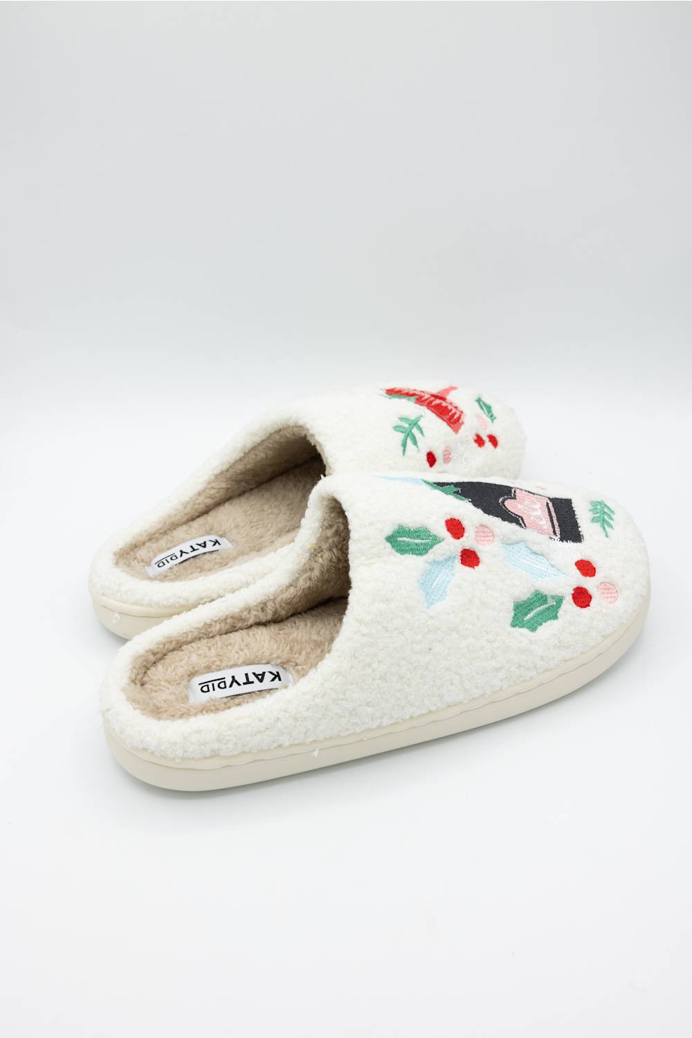 side profile of a white slipper featuring festive holiday drinks 
