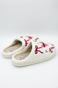 side profile of holiday themed slippers with bows and deer motifs 
