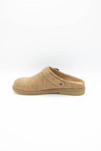 A single tan suede clog shoe shown from a side profile view against a clean white background.
