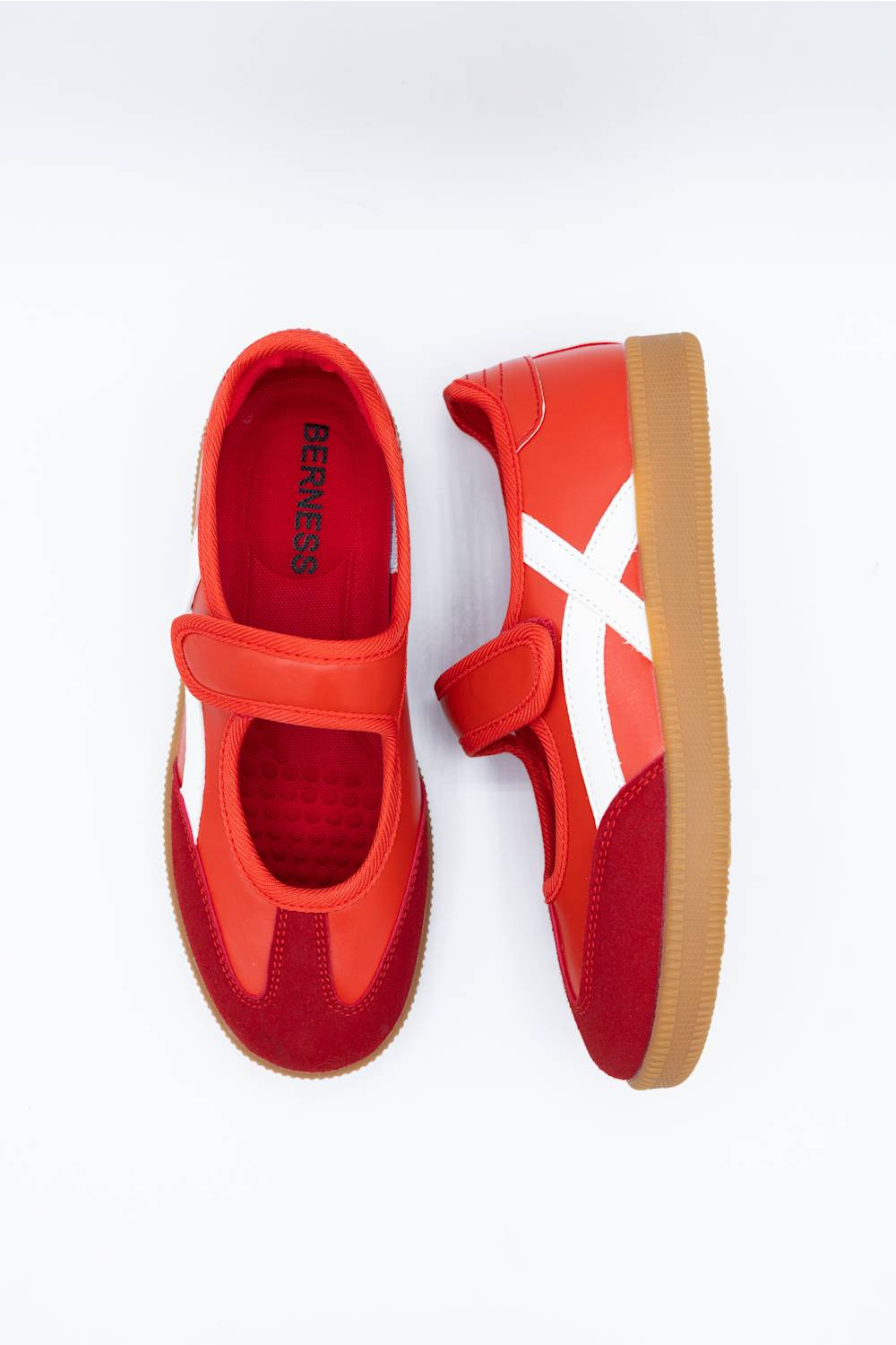 A pair of red and orange slip-on sneakers with white side accents and tan soles, shown from top and side views on a white background. The brand name 'BERness' is visible on the inner sole of the left shoe.