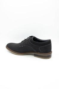 A black leather lace-up dress shoe with a low stacked heel and brown welt stitching, shown from a side profile on a white background.