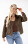 blonde woman modeling a floral jacquard newsboy cap 