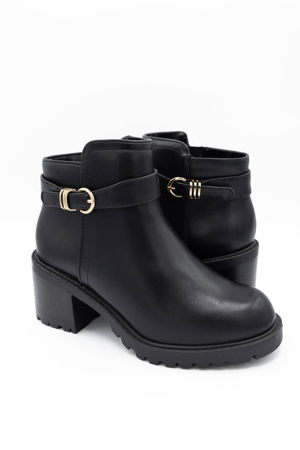 A pair of black leather ankle boots with chunky block heels, featuring a decorative strap with gold-tone buckles on the outer side and a side zipper, shown against a plain white background.