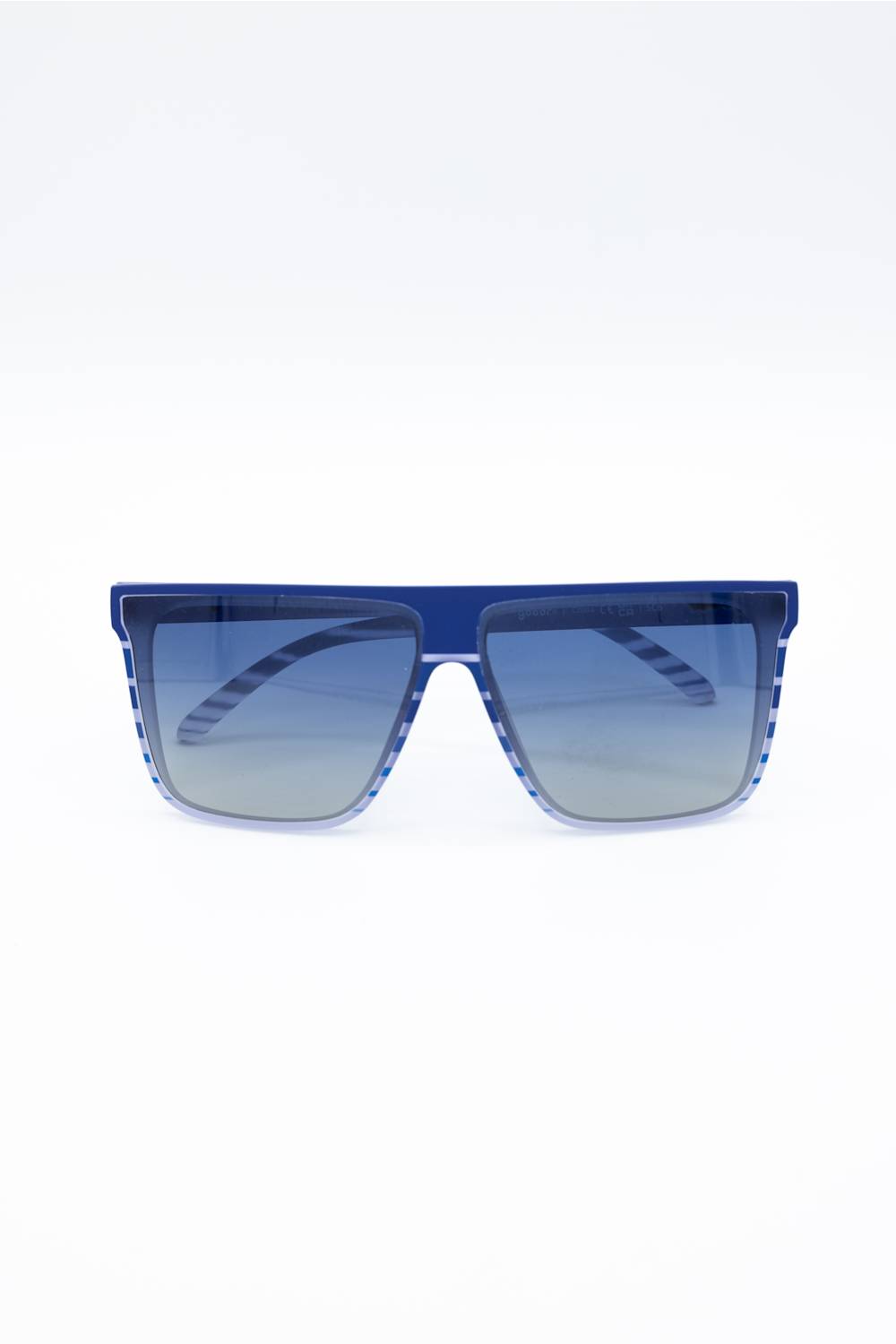 A pair of oversized square sunglasses with a translucent blue frame and gradient blue lenses, shown against a plain white background.