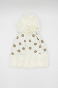 cream and brown polka dot beanie on a white background 
