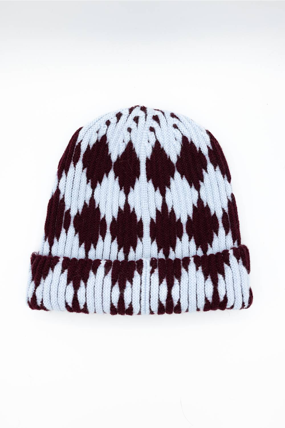 A ribbed knit beanie hat featuring a classic argyle pattern in dark burgundy and white, shown against a plain white background.
