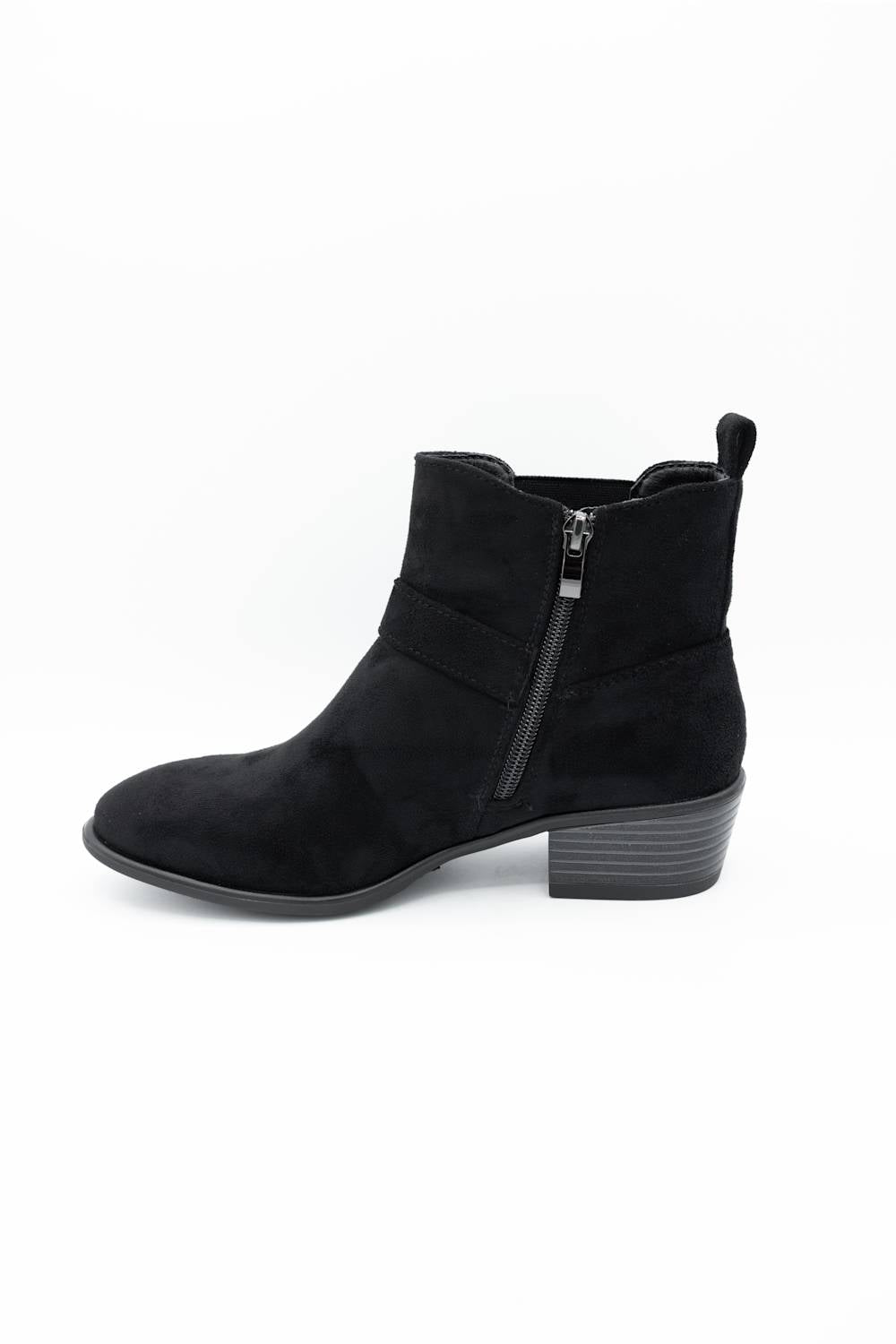A black suede ankle boot with a side zipper, low block heel, and pull tab, shown from a side profile on a white background.