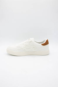 A low-top white sneaker with tonal embossed side detailing and a contrasting brown heel tab, shown from a side profile on a light gray background.