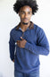 Butter soft, zipneck sweater with brown zipper and collar accents 