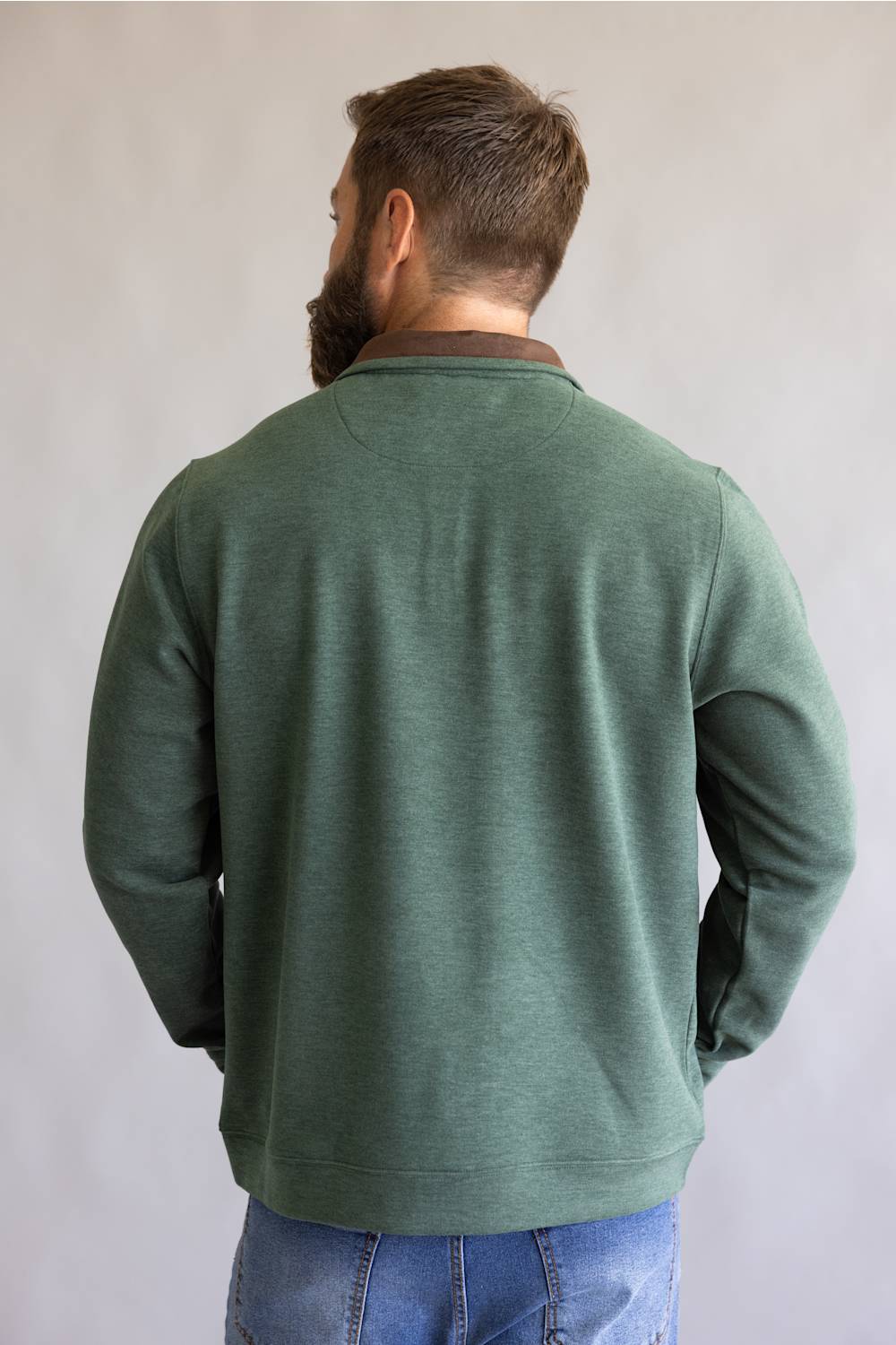 Buttery soft, zipneck pullover with brown zipper and collar accents 