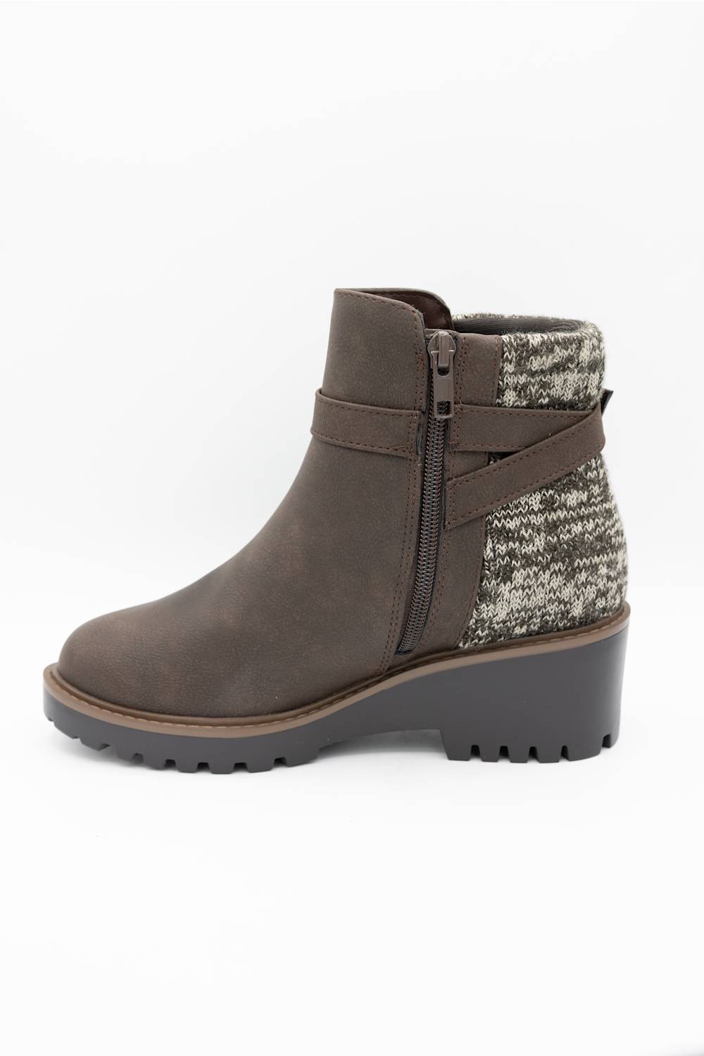 A brown suede ankle boot with a textured gray and white knit pattern panel on the side, a matching brown strap with a gold-tone buckle, and a chunky dark gray lug sole.