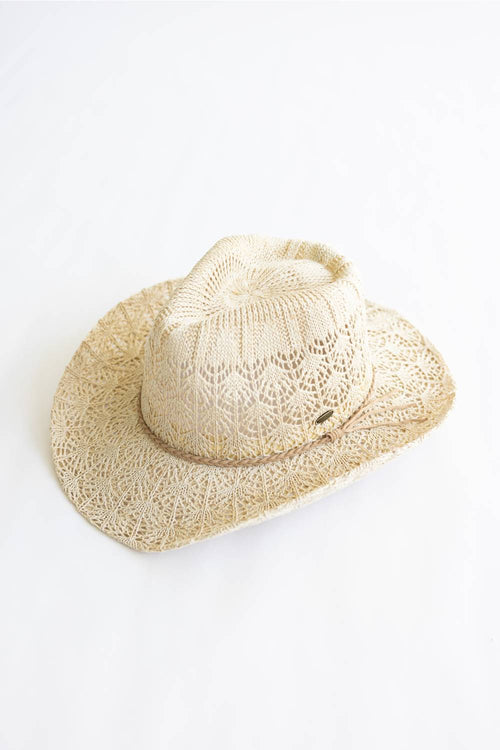 Beige straw cowboy hat on a white background