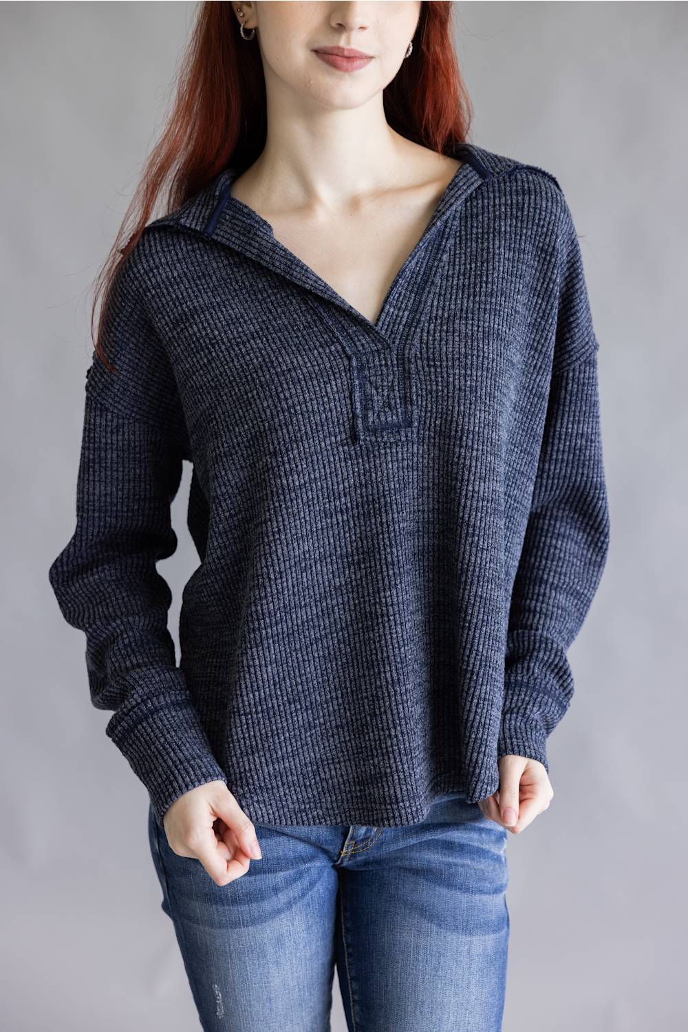 Ribbed v-neck sweater top with long sleeves and exposed seams