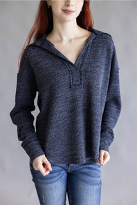 Ribbed v-neck sweater top with long sleeves and exposed seams