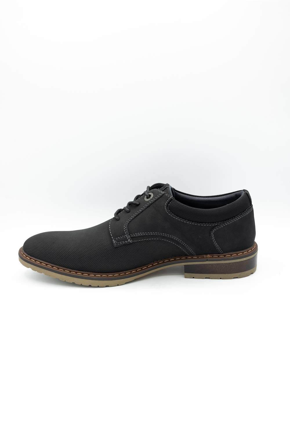 Black sneaker with white sole on a light gray background