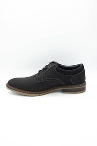 Black sneaker with white sole on a light gray background