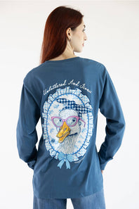 A woman shown from the back wearing a blue long-sleeve graphic T-shirt with a large duck illustration and the text 'Unbothered and Iconic' on the back, paired with blue jeans against a plain white background.