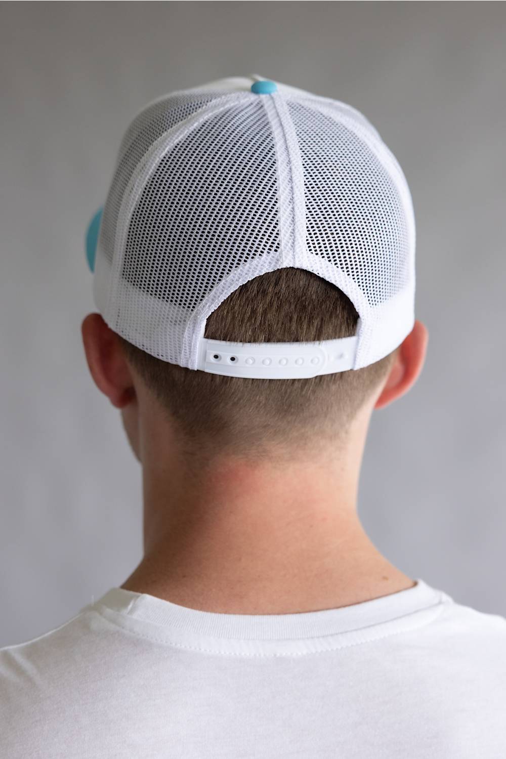 Whiskey Bent Candy Land Trucker Hat for Men in White/Teal
