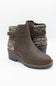 A pair of women's ankle boots in dark brown faux leather, featuring a textured gray and white knit fabric collar with a buckle strap detail, set against a plain white background.