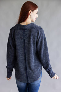 Ribbed v-neck sweater top with long sleeves and exposed seams