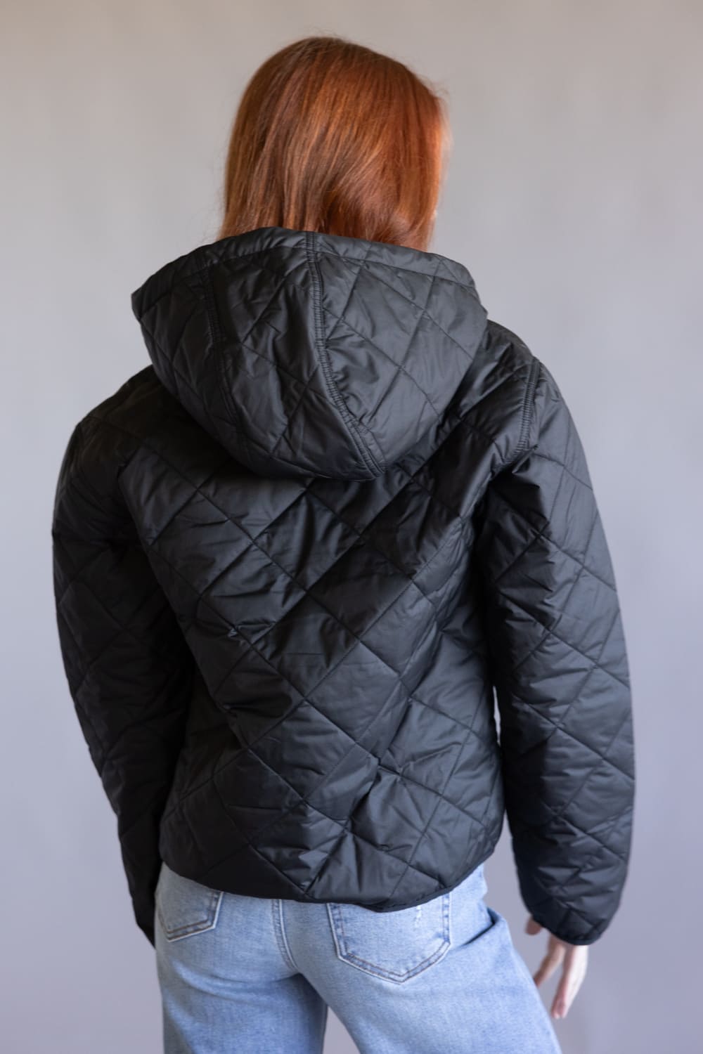 Patagonia Women's Diamond Quilted Bomber Hoodie Jacket in Black
