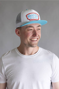 Whiskey Bent Candy Land Trucker Hat for Men in White/Teal