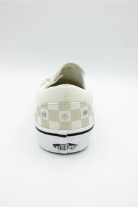 A single Vans platform sneaker shown from the back, featuring a white leather upper, a beige and white checkerboard pattern on the heel, silver metal studs, and a thick white platform sole with a black Vans logo.
