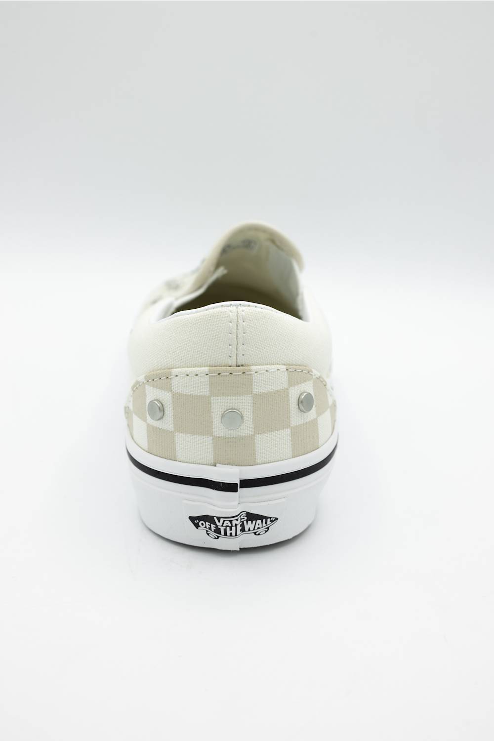 A single Vans platform sneaker shown from the back, featuring a white leather upper, a beige and white checkerboard pattern on the heel, silver metal studs, and a thick white platform sole with a black Vans logo.
