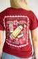 A red short-sleeve t-shirt with a large graphic print on the back, featuring a pink scalloped border, a yellow pencil, a red apple, and the text 'TEACHING IS A WORK OF ART' and 'simply southern' below it.