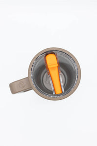 Top-down view of a gray insulated mug with a clear lid and an orange flip-straw insert, shown on a white background.
