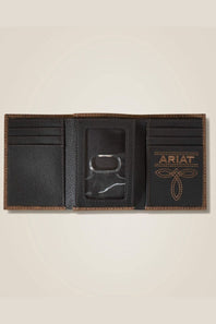 A black leather bifold wallet shown open, featuring card slots, a central ID window with a metal lock, and a tan embroidered ARIAT logo on the right panel, set against a light beige background.