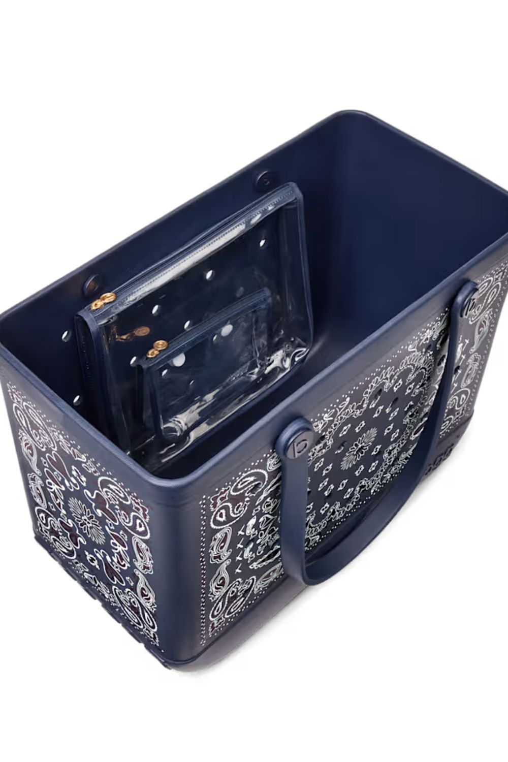 A navy blue plastic storage basket with white paisley patterns on the sides and handles, shown on a white background with a clear plastic organizer inside.