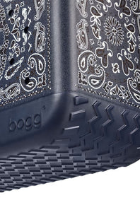 Close-up of a dark gray Bogg container with a white paisley bandana print on the sides and a textured dark gray base.