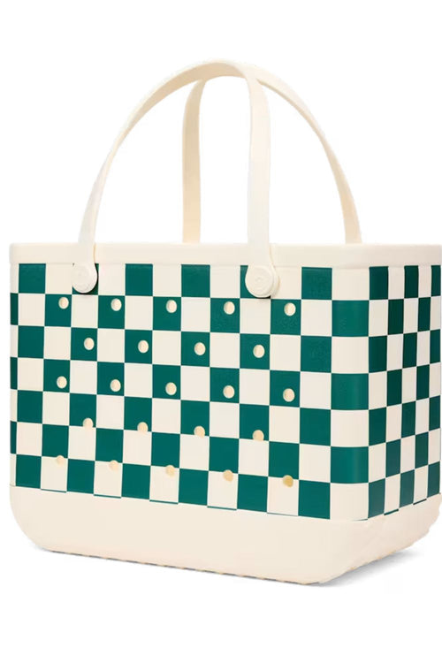 A structured tote bag featuring a green and cream checkerboard pattern with cream handles and a cream base, accented with small gold studs.