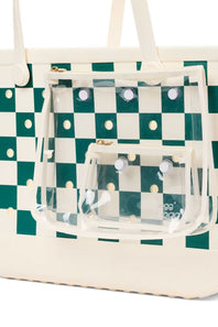 A cream canvas tote bag with a green and cream checkerboard pattern, featuring a clear plastic front pouch pocket with white snap buttons.