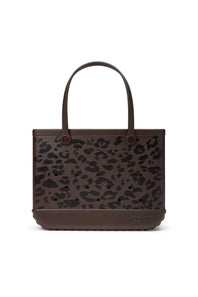 A brown tote bag with a dark brown and black leopard print pattern on the front, featuring solid brown handles and a matching brown base, shown against a plain white background.