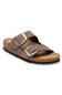 A pair of brown double-strap slide sandals with silver-tone metal buckles and a cork-look footbed, shown on a plain white background.