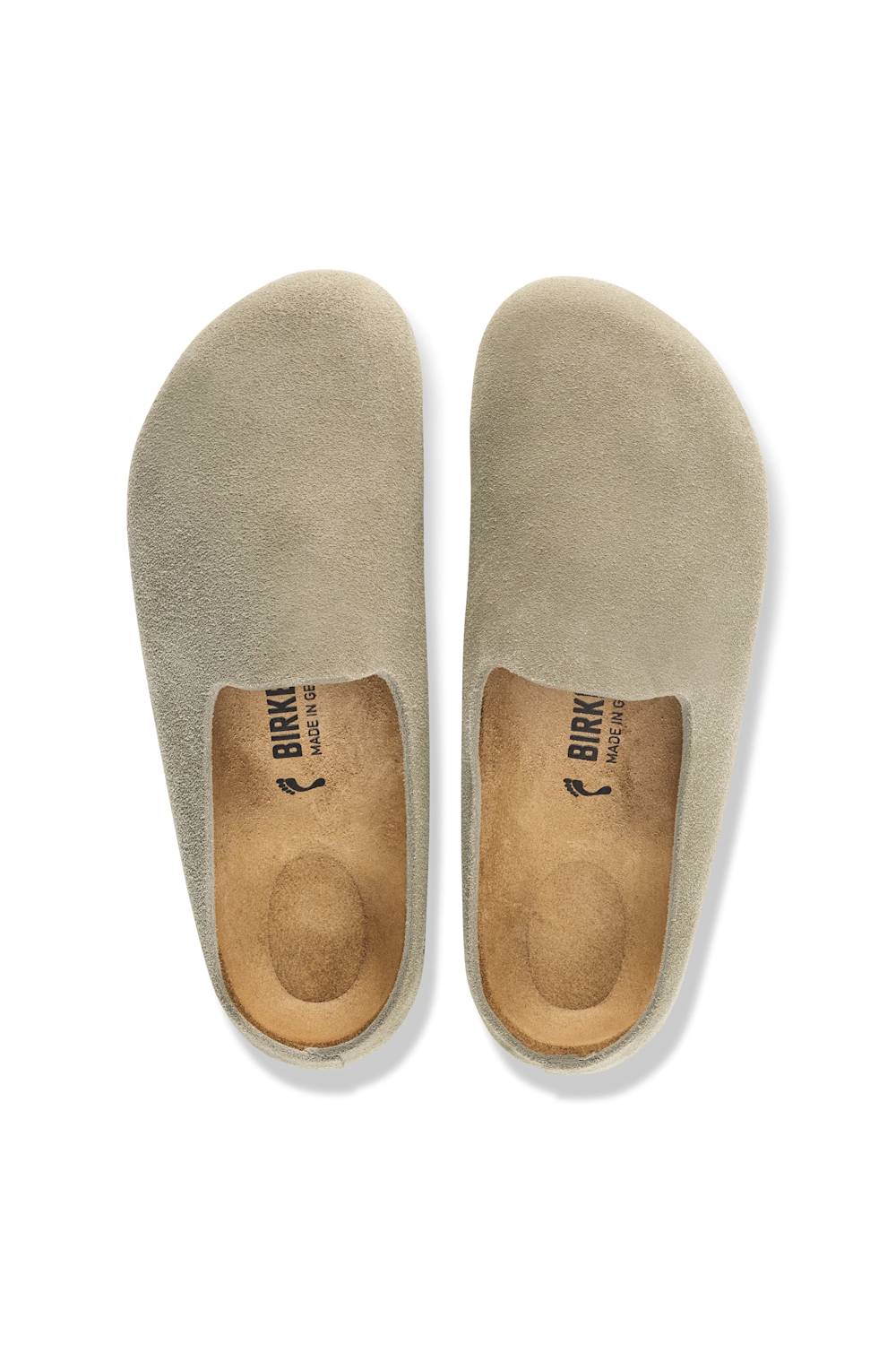 A pair slip-on shoes in a light taupe suede-like material, shown from a top-down view on a white background.