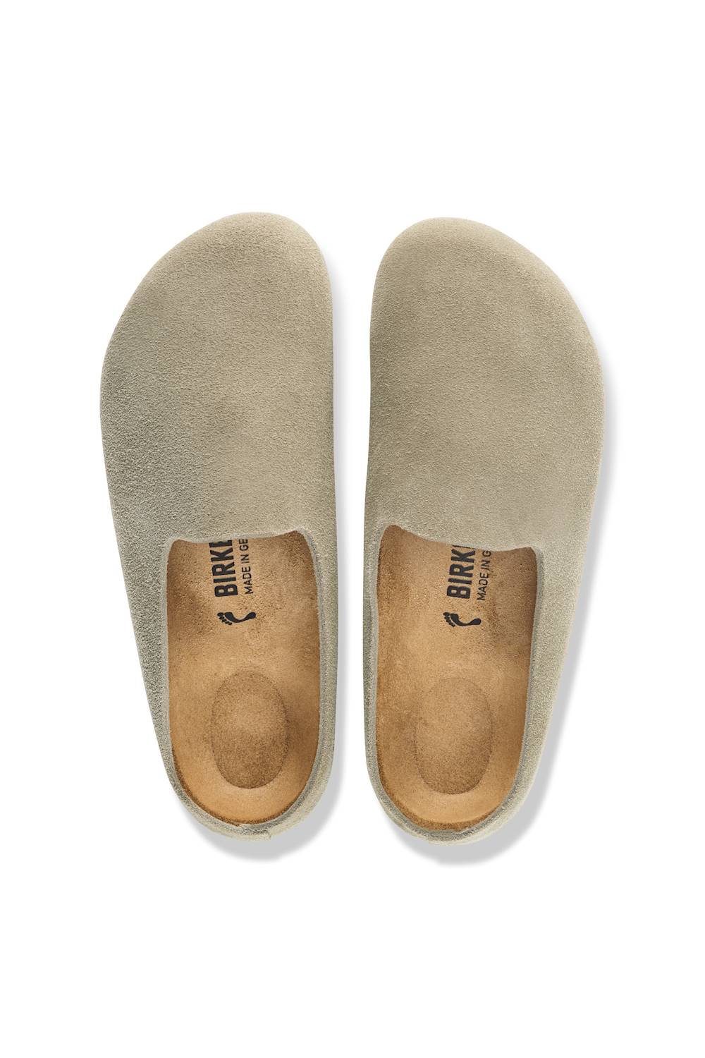 A pair of Birkenstock slip-on clogs in a light taupe suede-like material, shown from a top-down view on a white background.